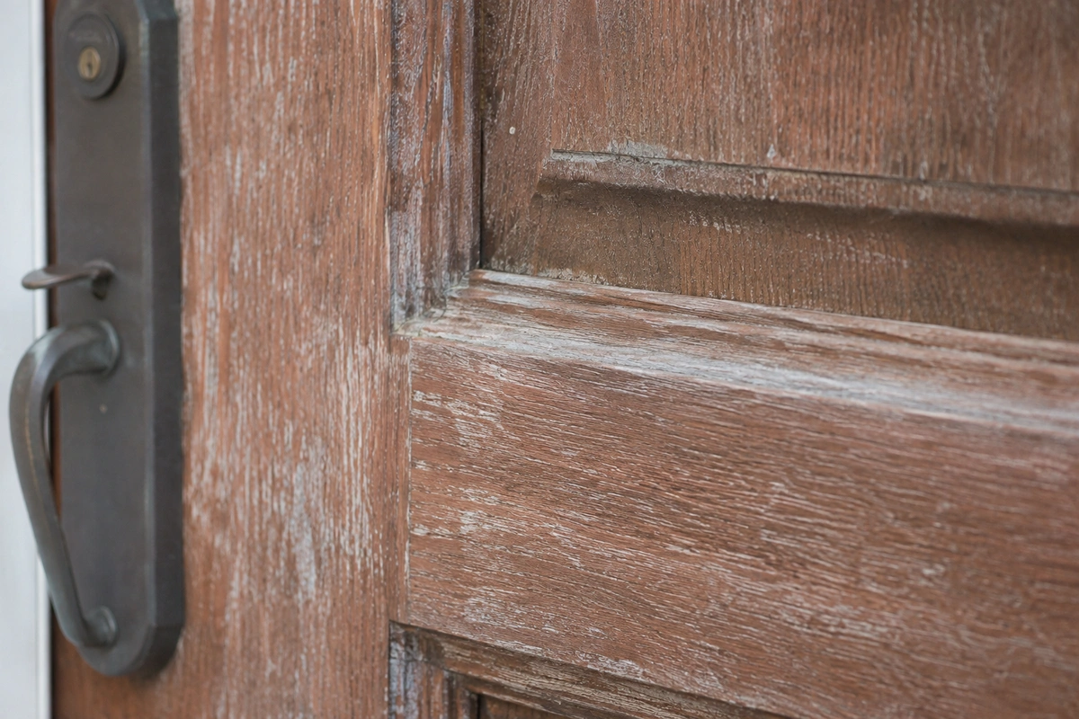 Expert Door Refinishing North Bay Village Services 3 Weathered mahogany entry door requiring door refinishing North Bay Village due to coastal salt air damage